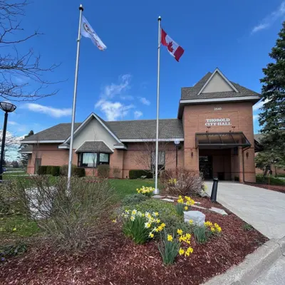 Blue background with images of people and City Hall and text that reads "City of Thorold Strategic Plan"